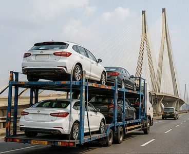 Agarwal Packers and Movers car carrier crossing a Mumbai bridge