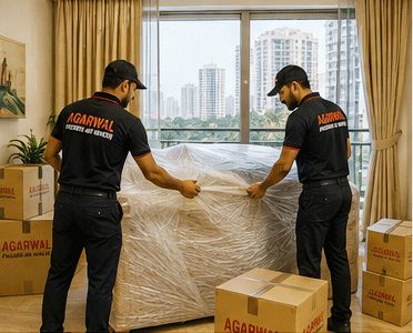 Agarwal Packers and Movers staff wrapping furniture before a move